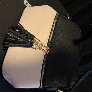 Chic Black and Cream Crossbody Bag with Tassel